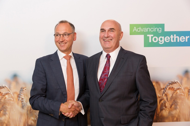 Werner Baumann (left), CEO of Bayer AG, and Hugh Grant, Chairman and Chief...