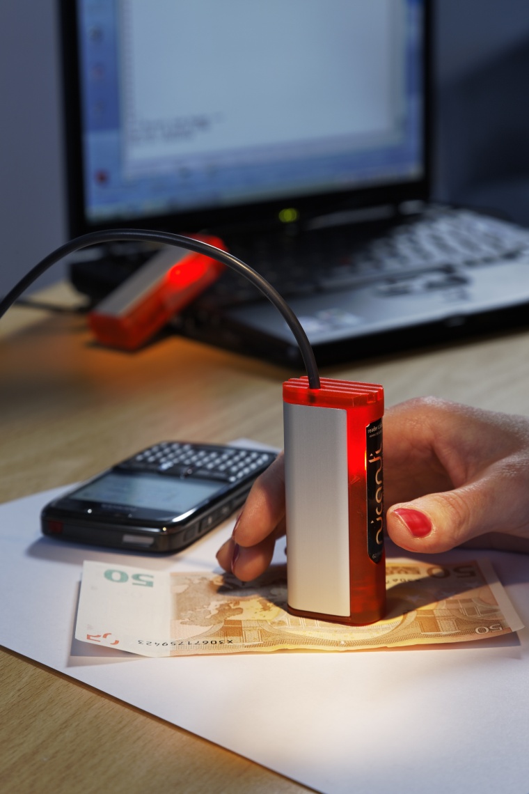 Authentication through invisibly printed codes and functionalities, detected by...
