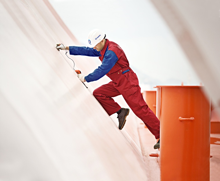 Coating inspector testing paint on structure (coated by Hempel) © Hempel
