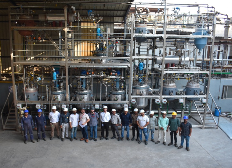 Key personnel from Novoloop and Aether Industries celebrate the achievement of...