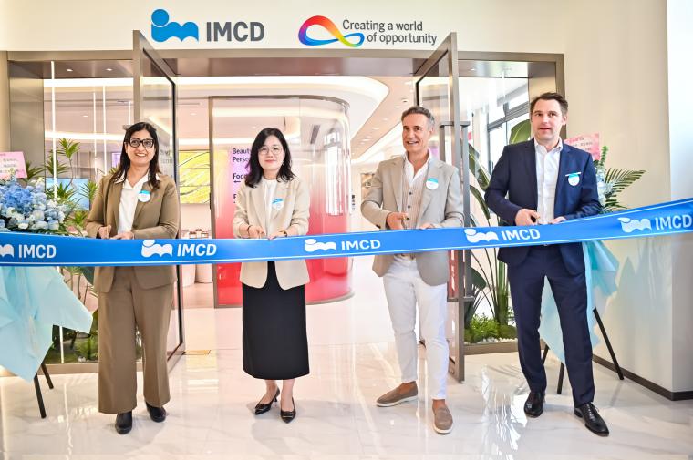 Company representatives at ribbon cutting.