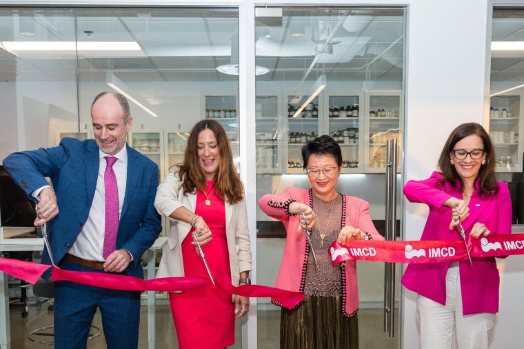 Company representatives at the ribbon cutting